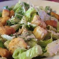 Caesar Salad · Romaine lettuce tossed with caesar dressing, parmesan cheese and croutons. Served with garli...
