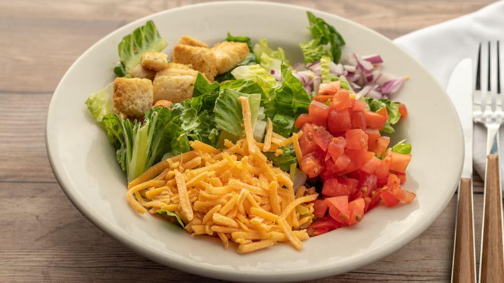 House Salad · House salad with mixed greens, tomato, red onion, cheddar cheese and croutons. Choice of dressing.
