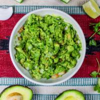 Table Side Guacamole  · Fresh avocado with tomatoes, onion, cilantro,jalapeno, squeezed lime and corn chips.