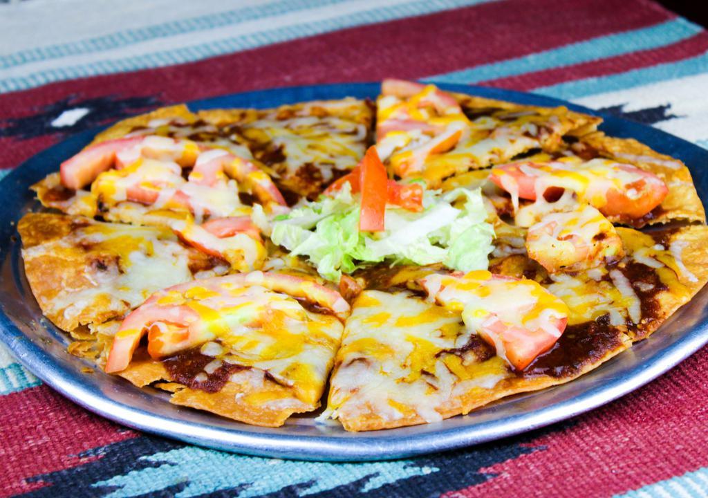 New Mexican Pizza · Crispy flour tortilla with melted cheese, red chile and tomatoes. Spicy.