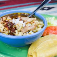 Red Chile Pozole · Pork and hominy soup. With a homemade flour or corn tortilla. Spicy New Mexican chile.