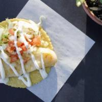 Grilled Fish Burrito · Grilled Fish, Cabbage, Salsa Fresca + White Sauce.