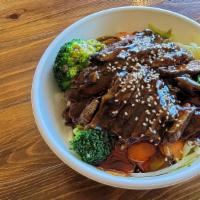 Kobe Beef · Teriyaki sauce over grilled steak and steamed veggies. Served over rice and finished with to...