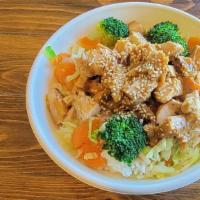 Peanut Chicken · Peanut sauce sautéd with grilled chicken breast served over steamed veggies and rice.