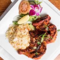 Chicken Tikka · Tender leg Quarters chicken marinated in yogurt, exotic spices and herbs (Served with Rice, ...
