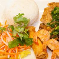 Com Tôm Sườn Nướng Chả Gi · Grilled pork chop, grilled shrimp and egg roll with jasmine rice.