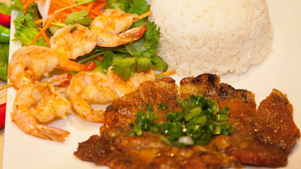 Com Sườn Nướng Tôm · Grilled pork chop and grilled shrimp with jasmine rice.