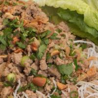 Lettuce Wraps · Shiitake mushrooms, chicken, water chestnuts, scallions topped with peanuts on a bed of cell...