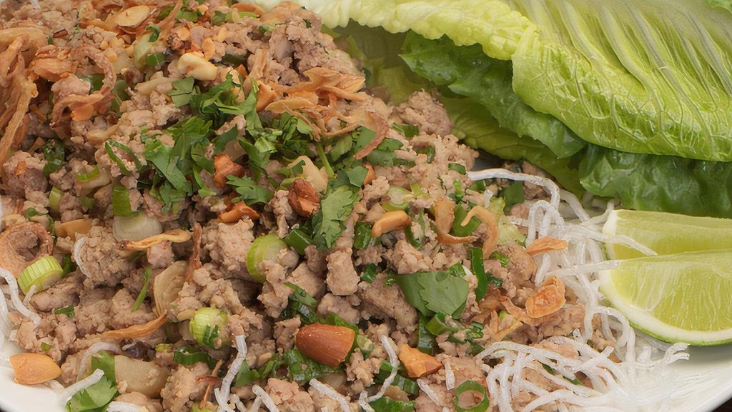 Lettuce Wraps · Shiitake mushrooms, chicken, water chestnuts, scallions topped with peanuts on a bed of cellophane noodles. Served with crispy romaine.
