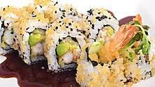 Tootsie Roll · 8pcs of cut roll seaweed rice cucumber avocado crab mix shrimp tempura sesame seeds outside ...