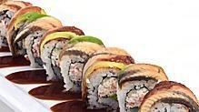 Dragon Roll · California (seaweed rice cucumber avocado crab mix) roll with seared sweet marinated eel ont...