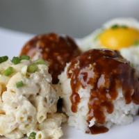 Loco Moco · Juicy ground-beef patty with grilled onions, gravy, and sunny-side up egg. Served with two s...