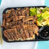 Beef Short Ribs · Strips of marinated beef short ribs (bone-in). Includes white rice, drizzle of Joybox's teri...