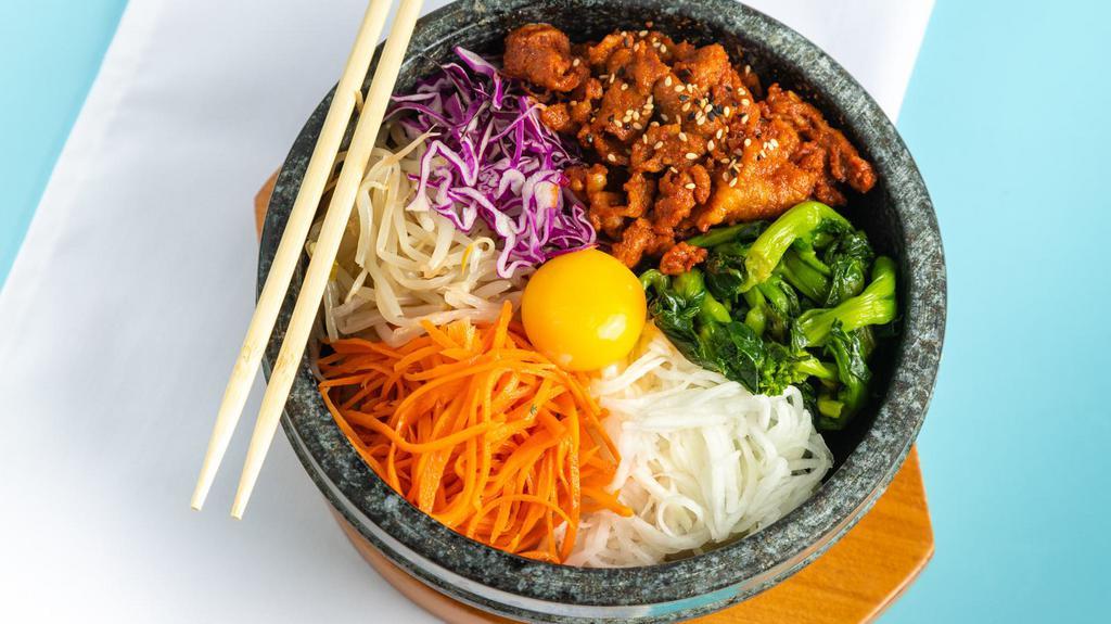 Bibimbap With Spicy Pork · Traditional Korean food. Includes spicy pork, white rice,  seasoned canola herbs, red cabbage, beansprout, carrot, radish, egg,  and  Joybox's special hot sauce