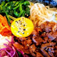 Bibimbap With Beef · Traditional Korean food. Includes beef, white rice,  seasoned canola herbs, red cabbage, bea...