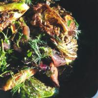 Fried Brussels · Deep fried crispy brussel sprouts, charred red onions, parsley, mint, dill , agrodolce vinai...