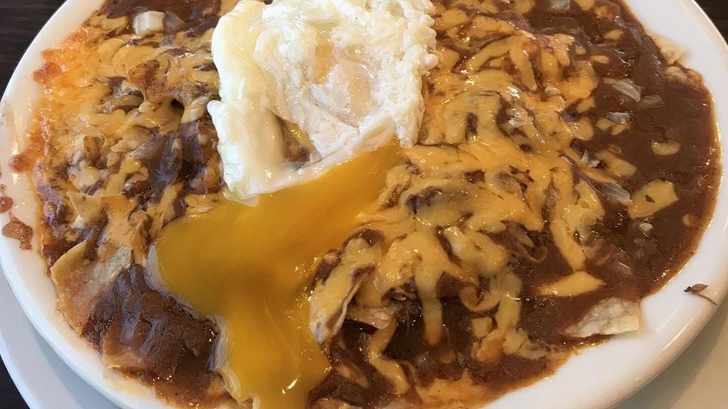 Chilaquiles · Choice of cheese, machaca, ground beef or chicken, red or green sauce topped with an egg.