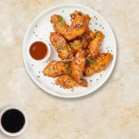 Thai Hot Wings · Fresh chicken wings breaded, fried until golden brown, and tossed in Thai hot sauce.