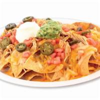 Nachos · With choice of meat, refried beans, black beans, tomato, Jalapeño pepper slices, sour cream,...
