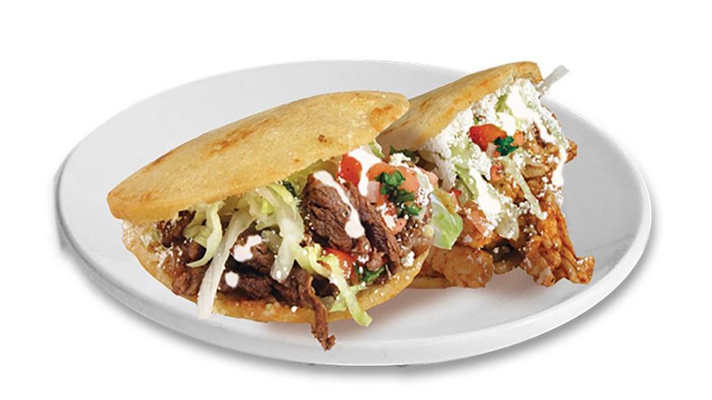 Gorditas (2) · Choice of meat, beans, onions, cilantro, salsa, lettuce, tomato, Mexican cream & Mexican cheese.