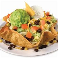 Taco Salad · With choice of meat, onions, re-fried beans, lettuce, cilantro, cheese, guacamole, sour crea...