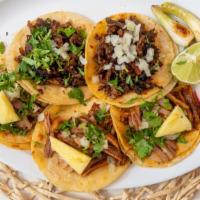 Tacos · Corn tortillas with choice of meat with onions and cilantro on the side.