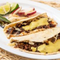 Tacos Suizo  · Corn tortilla with asada meat cut from el trompo, with cheese and salsa. Each