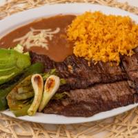 Carne Asada / 15. Grilled Steak · Arrachera (8 oz) acompañada de arroz, frijoles y nopal,  aguacate y cebollita. / Arrachera (...