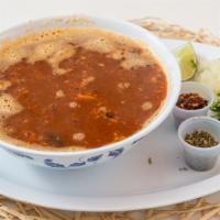 Menudo · Beef strip soup served in hot bowl. Served on the side with onions, green chile, and lemon.