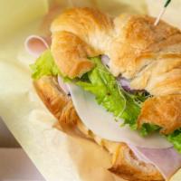 Croissant Sandwich · Choose from Turkey, Ham, Tuna or Chicken Salad with your choice of veggies & cheese on a but...