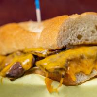 Garlic Dip · Sliced Roast Beef,  Cheddar cheese, and Garlic seasoning served hot on a sourdough loaf with...