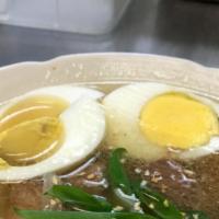 Mami Soup · Chicken or beef, served with egg noodles, fried garlic, green onions, and egg.