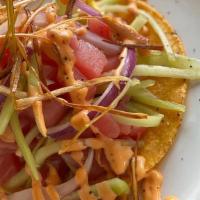 Tostada De Atun Fresco · Fresh tuna cubes mixed with cucumber, onion and
salsa negra, finished with chipotle dressing...