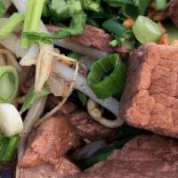 Beef Stew Noodles # 1 · Beef stewed in dark broth topped with fried garlic, scallion, cilantro