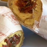 Breakfast Burrito · Scrambled eggs, salsa, avocado and swiss cheese wrapped in a flour tortilla, served with bre...