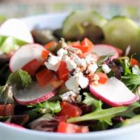 Signature Salad · Nut-crusted goat cheese, mixed baby greens, tomatoes, cucumbers and radishes served with our...