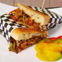Philly Cheese Steak Panini · Mayo, Green Pepper, Yellow Pepper, Red Pepper, Onion and American Cheese