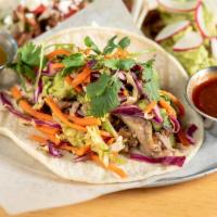 Pork Taco · Made without gluten. Pulled pork, green chiles, verde sauce, guacamole, and cilantro-lime sl...