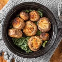 Stuffed Mushrooms · Baked mushrooms stuffed with spices and bread crumbs.