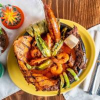 Molcajete · Carne asada, pollo asado, chorizo, queso ranchero, shrimp, and grilled cactus. Served with m...