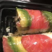Rainbow Roll · Crab mix, cucumber, rolled and topped with tuna, salmon, yellowtail, shrimp, and avocado