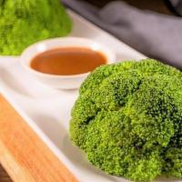 Broccoli W/ Seafood Sauce 蚝油西兰花 · Boiled broccoli with seafood sauce on the side.