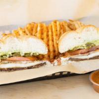 Torta Cm · Breaded beef and breaded chicken topped with mozzarella cheese, tomato, onions, jalapeños, a...
