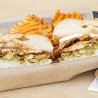 Torta Ranchera · Topped with guacamole, queso fresco, and chipotle dressing. Served with fries.
