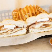 Torta Usa · Breaded chicken with ham and mozzarella topped with queso fresco, pineapple, and chipotle dr...
