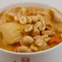 35 Gang Massaman · Tamarind with coconut milk, onions, potatoes, carrots, and roasted peanuts.