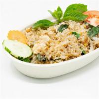 Lao Fried Rice · Stir-fried rice with onions, tomatoes, and egg.