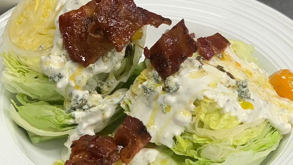 Chopped Wedge Salad · Gluten Friendly. Candied bacon, chive oil, confit tomatoes, crumbled bleu cheese, bleu cheese dressing.