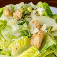 Classic Caesar Salad · Modification available. Shaved parmesan, caesar dressing, torn croutons.