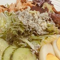 Cobb Salad · Gluten Friendly. Tomatoes, cucumbers, bacon, hard boiled egg, bleu cheese, grilled chicken, ...